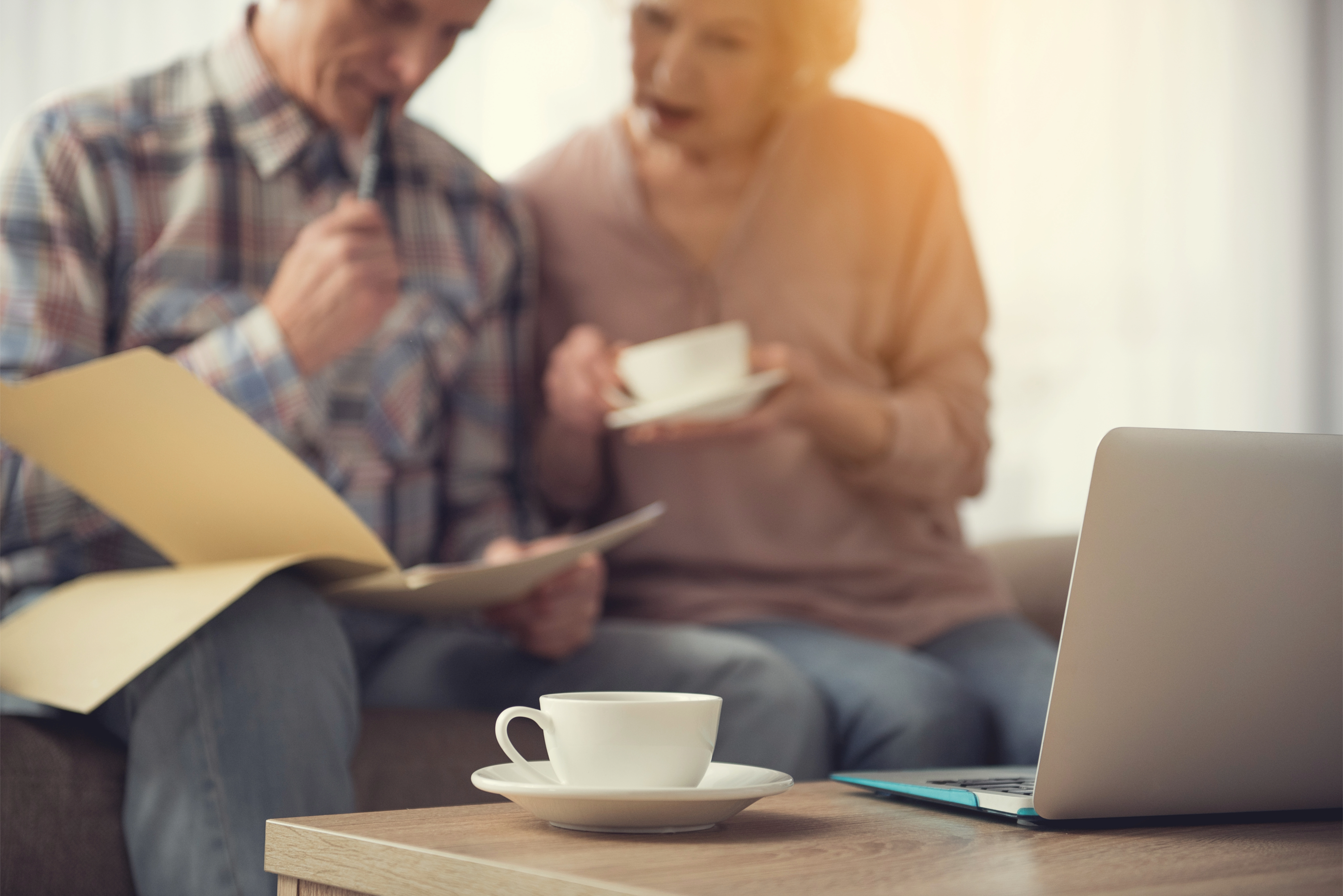 Elderly couple looking at documents