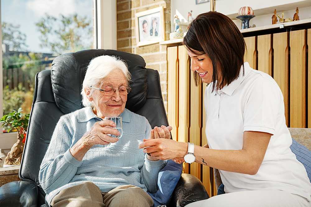 Elderly lady using live in care in London with carer
