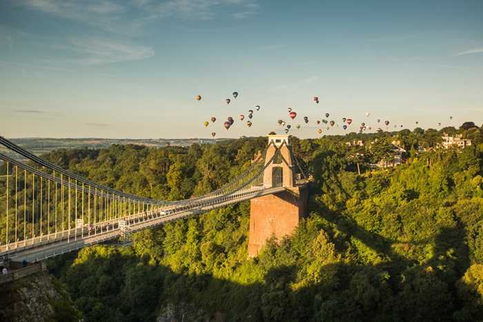 colourful hot air balloons float in the sky over Bristol in the South West of England