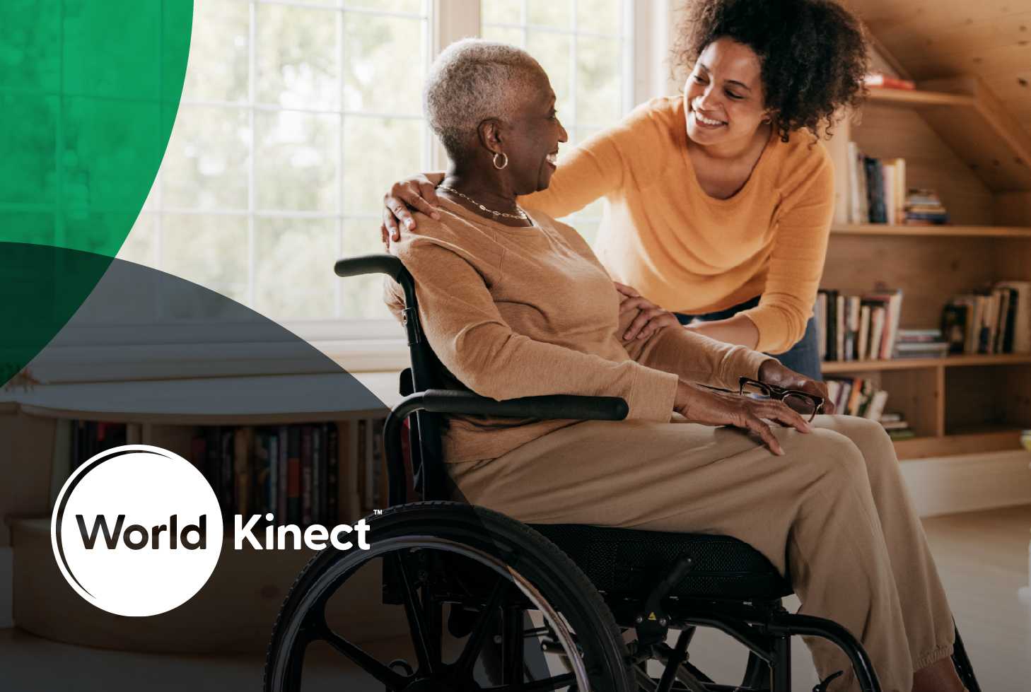 World Kinect - Elderly woman in wheelchair next to carer