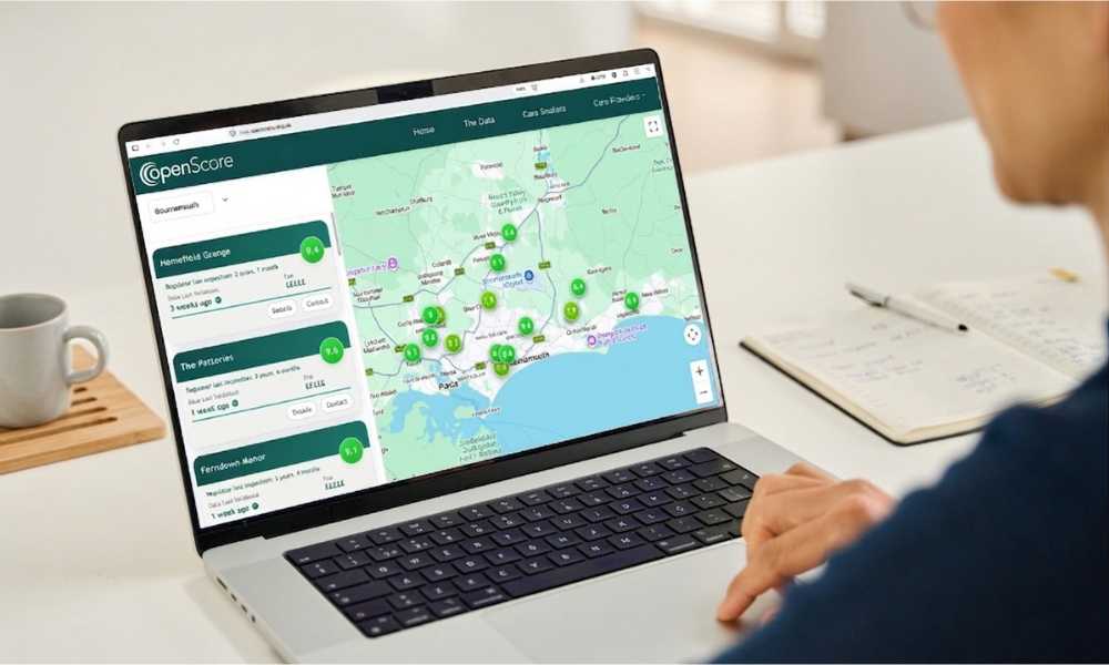 A person browsing the OpenScore care home map on a laptop at a desk