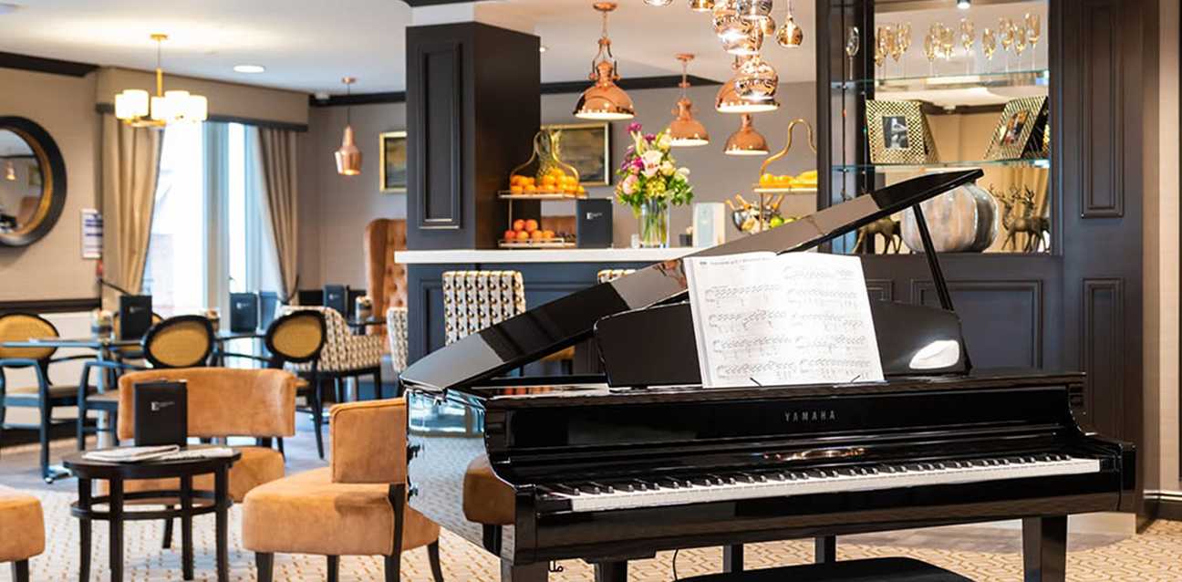 Interior of Eastcote Park Care Home piano lounge