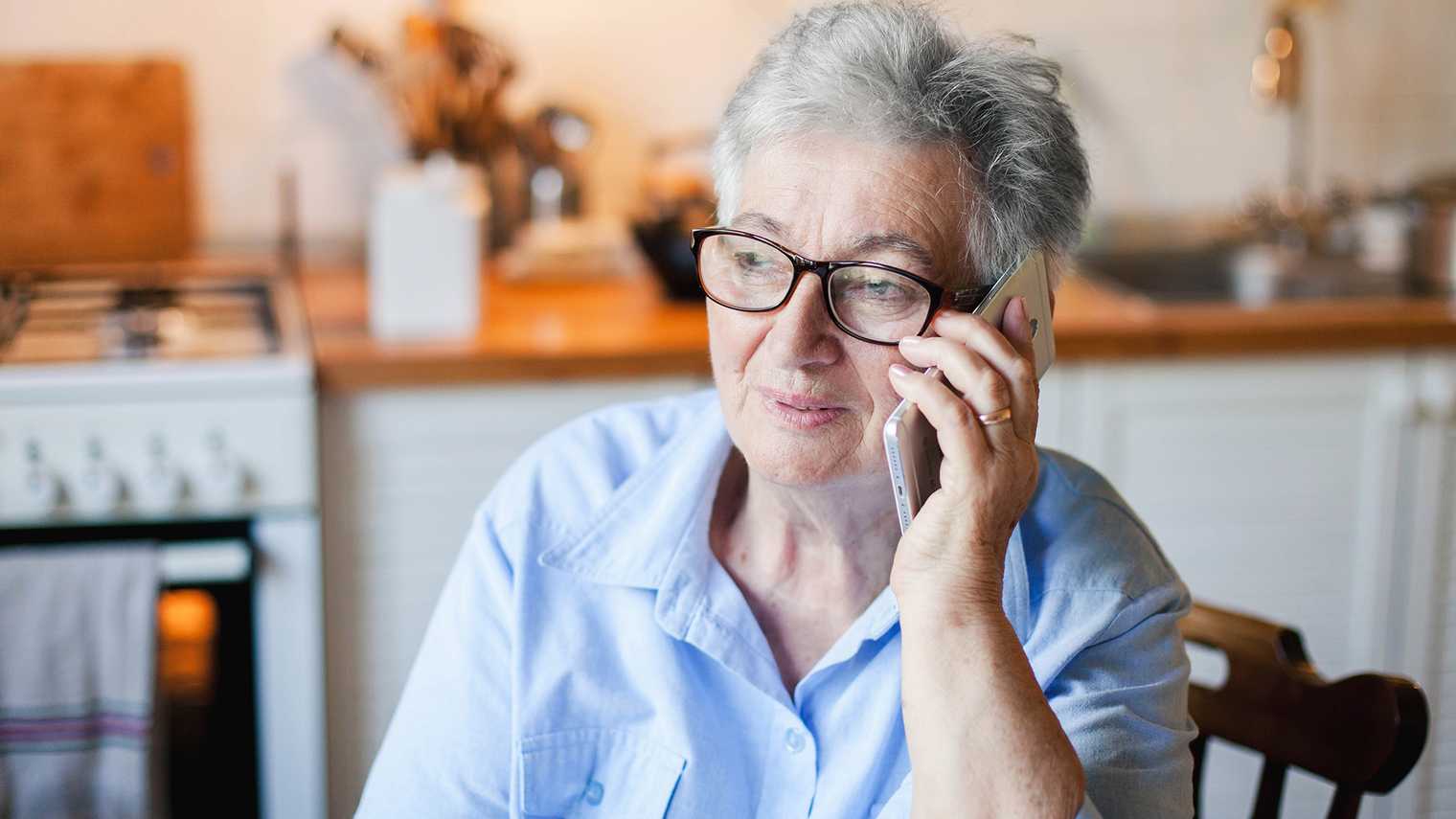 Mature woman holding a phone