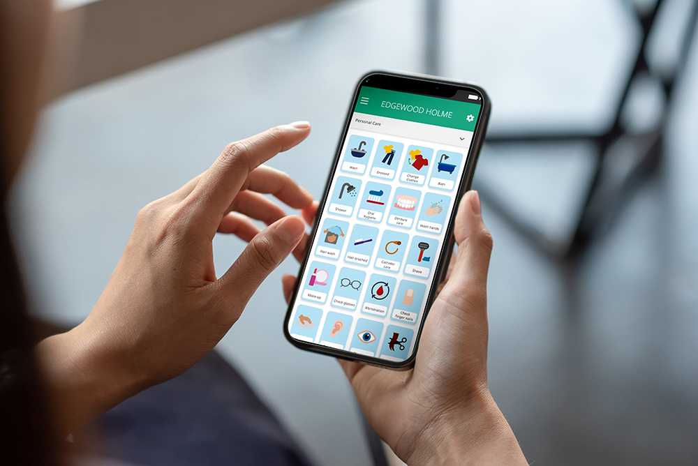 Hands holding digital care planning mobile phone