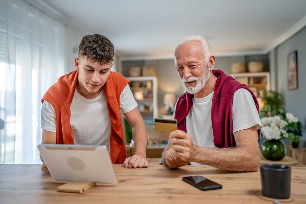 young man and old man discussing are next of kin responsible for paying for care
